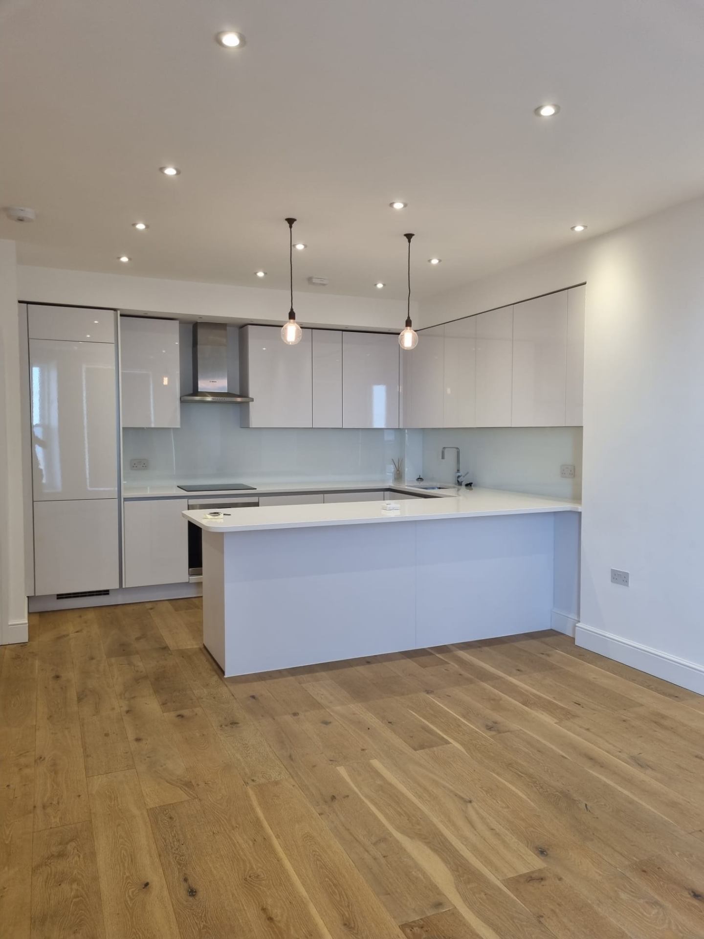 White Gloss Kitchen with Pendant Lights